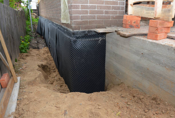 SJ Waterproofing Pros technician performing targeted Wet Basement Repair assessment in Rhoadesville, VA